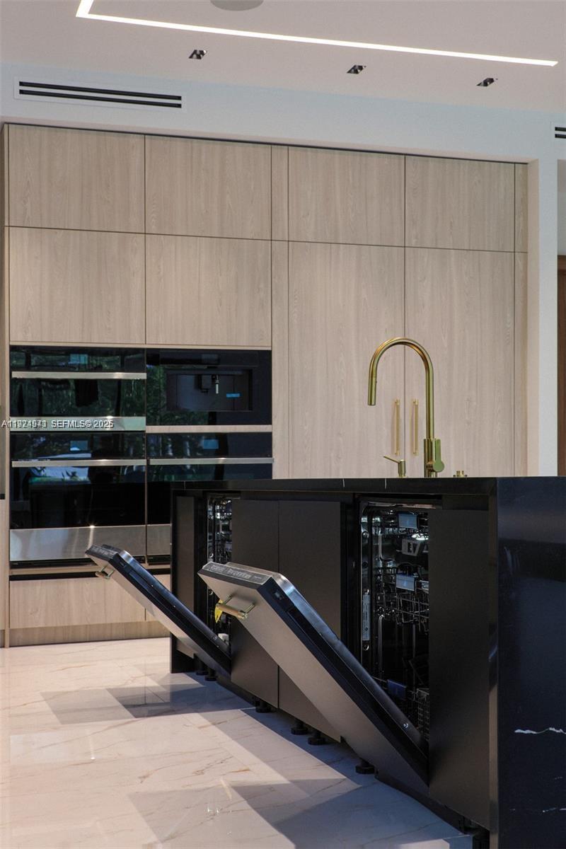 5903 Southwest 54th Court Davie, FL 33314 - Photo 12 of 47 a kitchen with a sink and cabinets