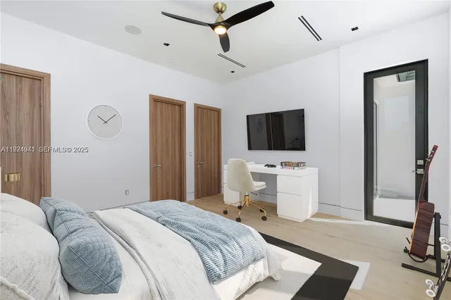 a bedroom with a bed and a table