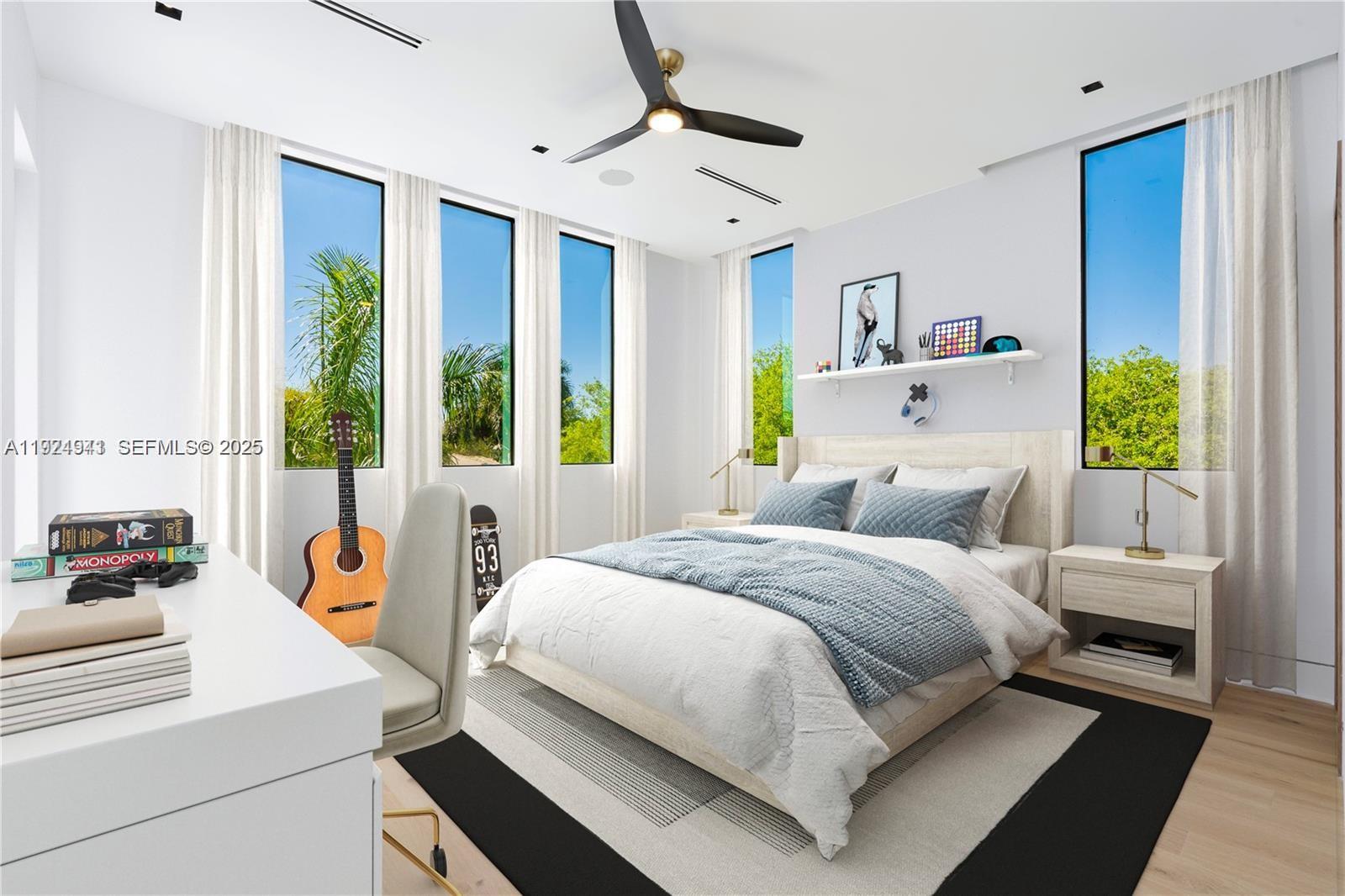 5903 Southwest 54th Court Davie, FL 33314 - Photo 18 of 47 a bedroom with a bed wooden floor and window