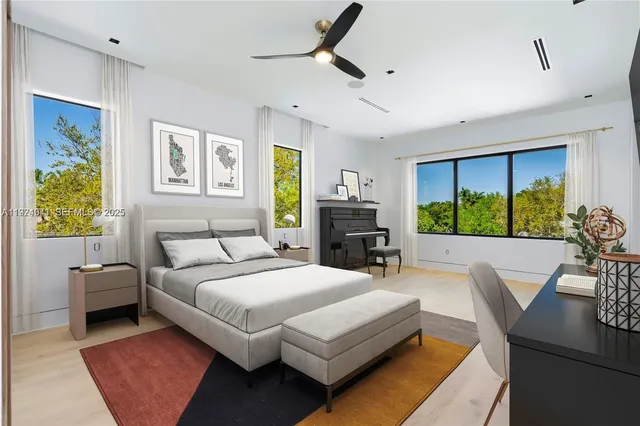 a view of a livingroom with furniture and a floor to ceiling window
