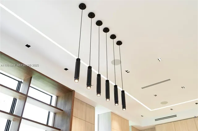 a bedroom with a bed and a flat screen television