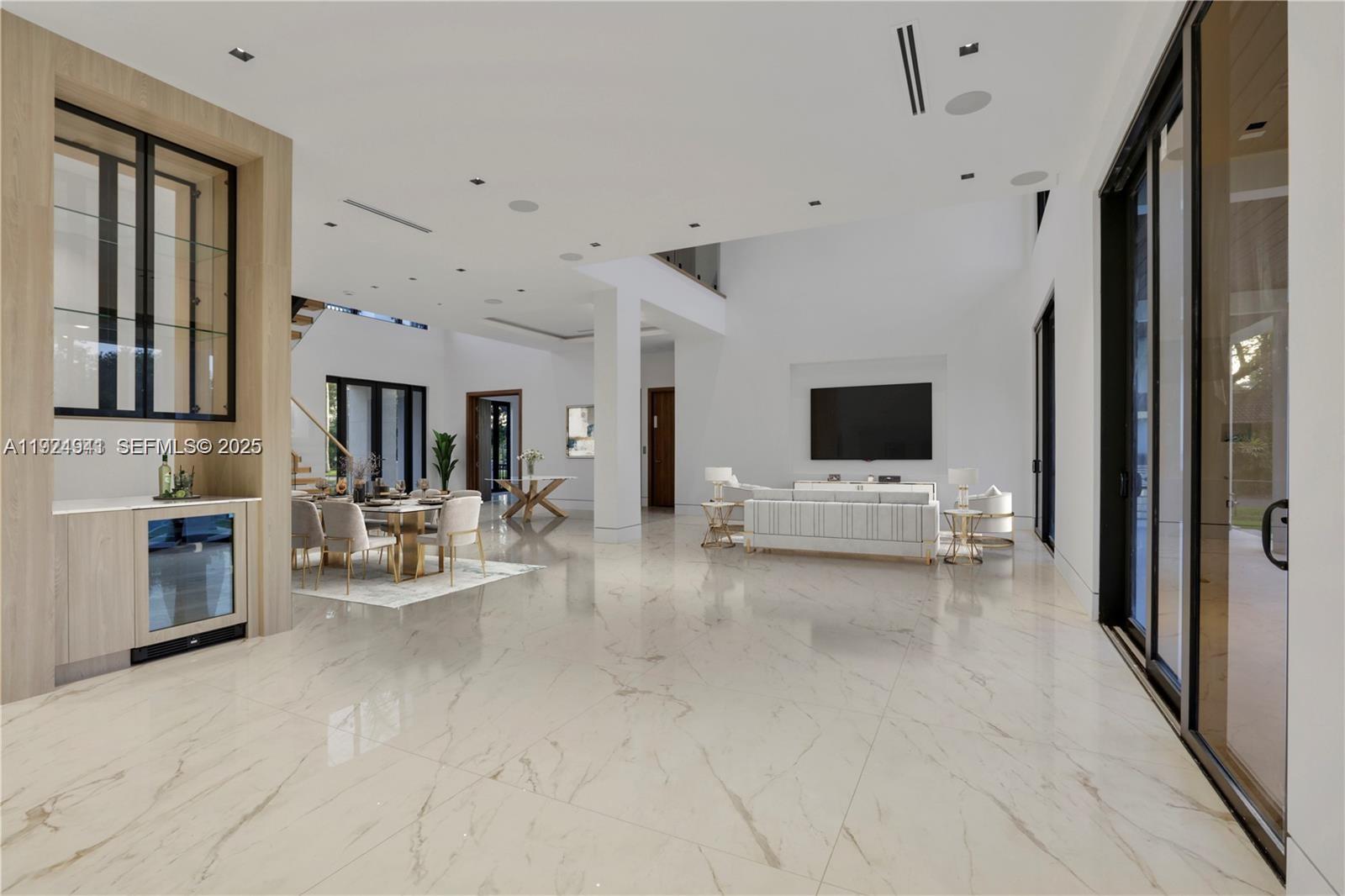 5903 Southwest 54th Court Davie, FL 33314 - Photo 22 of 47 a living room with furniture and a flat screen tv