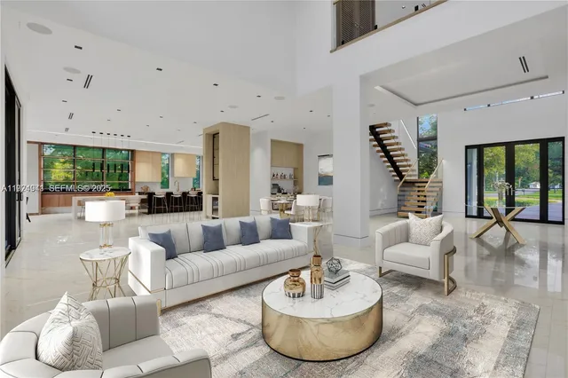 a bathroom with a tub a sink and a large mirror