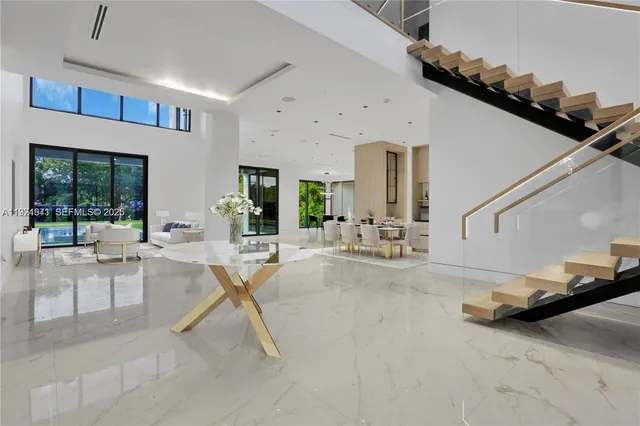 a kitchen view with wooden floor and windows