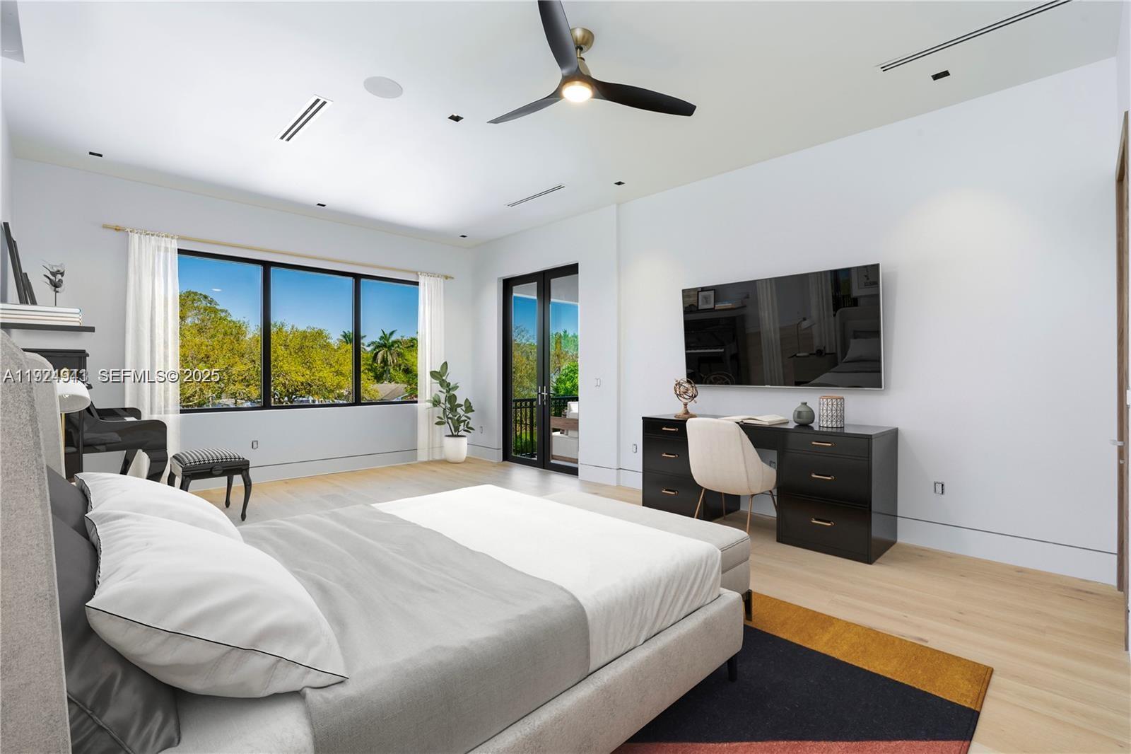 5903 Southwest 54th Court Davie, FL 33314 - Photo 26 of 47 a bedroom with a bed and a flat screen television