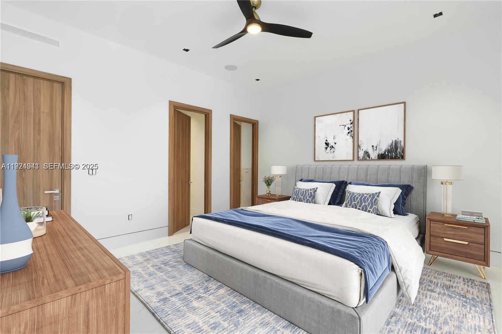 5903 Southwest 54th Court Davie, FL 33314 - Photo 36 of 47 a bedroom with a large bed and a chandelier