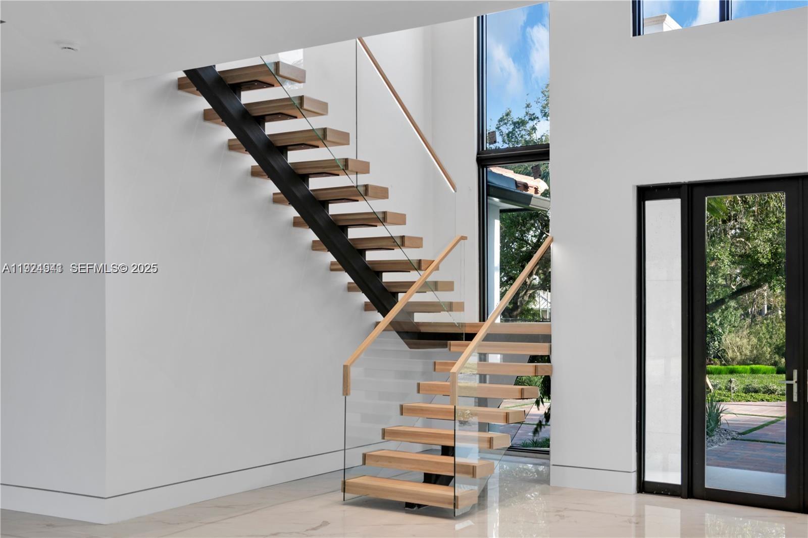 5903 Southwest 54th Court Davie, FL 33314 - Photo 38 of 47 a view of entryway and hall with wooden floor