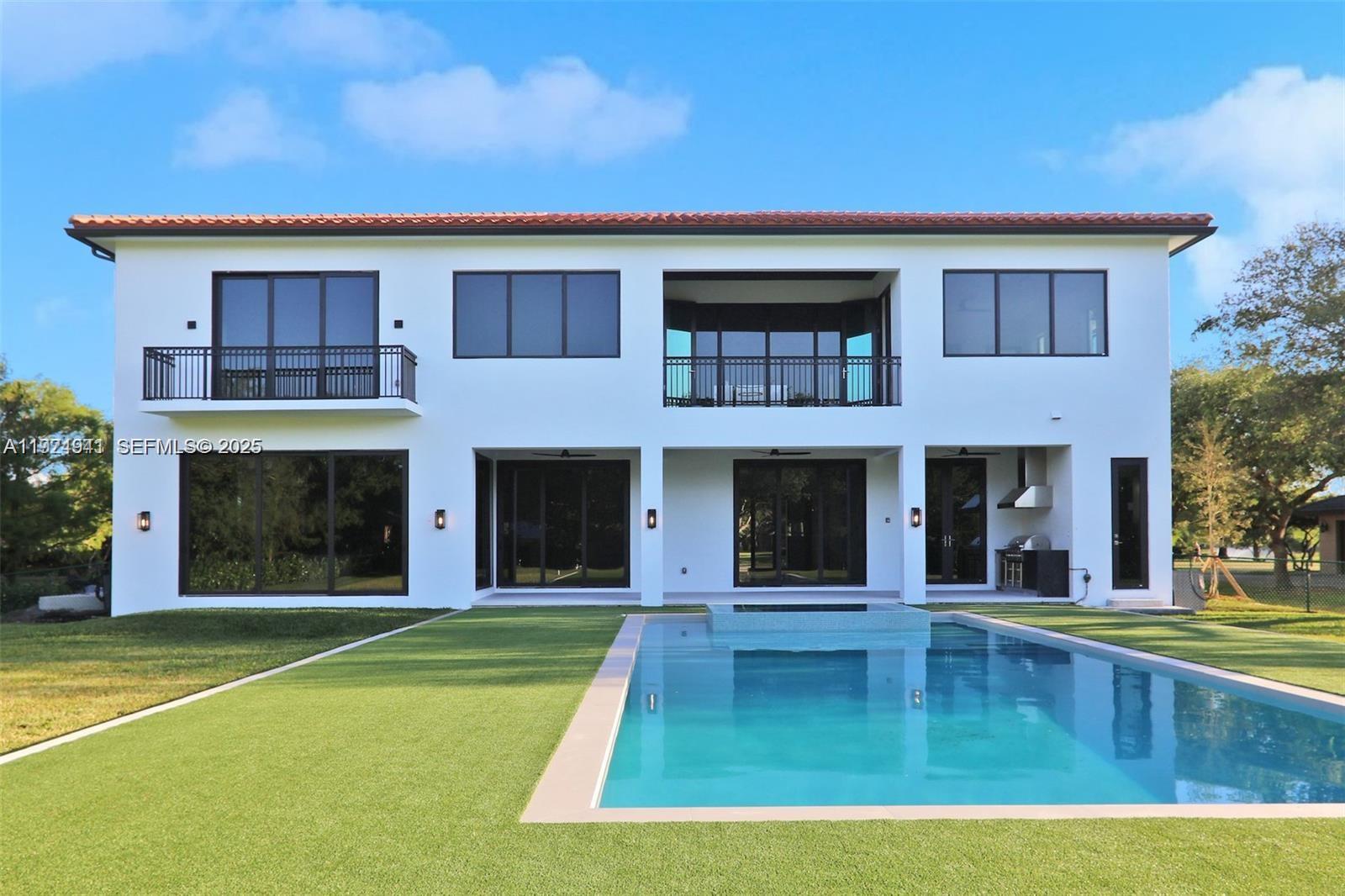 5903 Southwest 54th Court Davie, FL 33314 - Photo 43 of 47 a view of a house with swimming pool and a large window