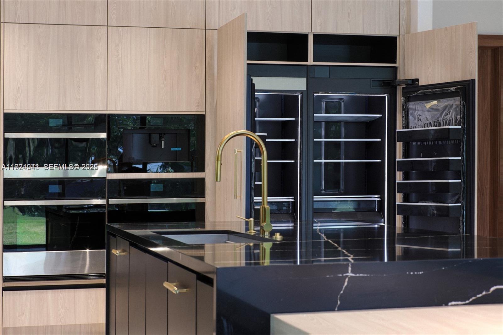 5903 Southwest 54th Court Davie, FL 33314 - Photo 8 of 47 a kitchen with appliances cabinets and a sink