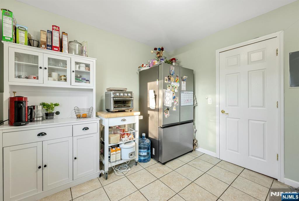 16-08 Plaza Road, Unit B Fair Lawn, NJ 07410 - Photo 13 of 16 a kitchen with cabinets and wooden floor