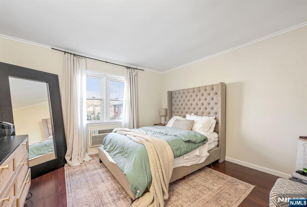 16-08 Plaza Road, Unit B Fair Lawn, NJ 07410 - Photo 14 of 16 a bedroom with a bed and wooden floor