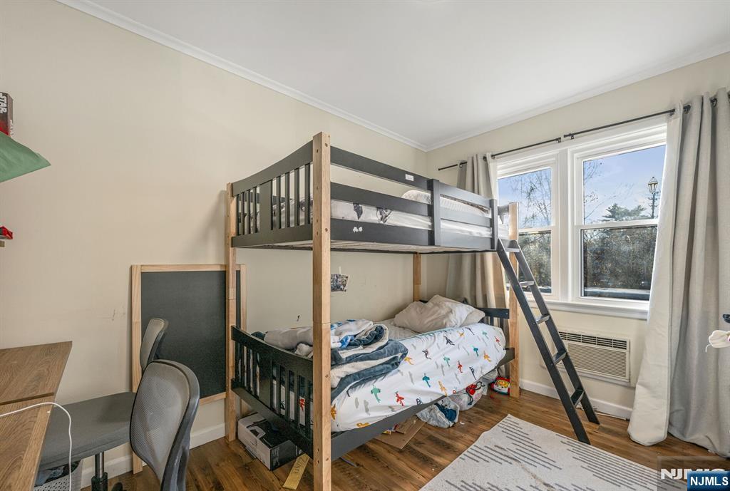 16-08 Plaza Road, Unit B Fair Lawn, NJ 07410 - Photo 15 of 16 a bedroom with a bed and a window