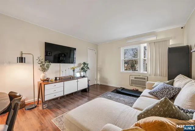 a bedroom with furniture and flat screen tv