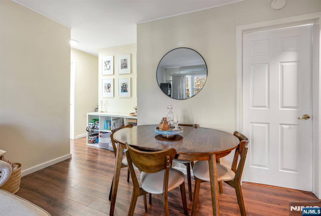 16-08 Plaza Road, Unit B Fair Lawn, NJ 07410 - Photo 9 of 16 a dining room with furniture and wooden floor