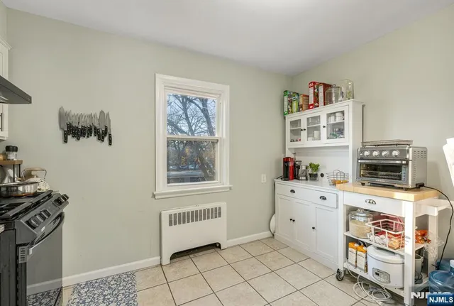 a room with furniture and a stove top oven