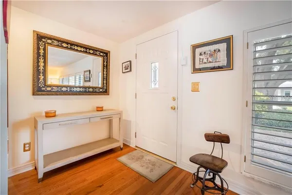 a view of an empty room and wooden floor