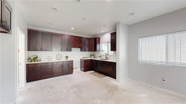a large bathroom with a large mirror vanity and shower