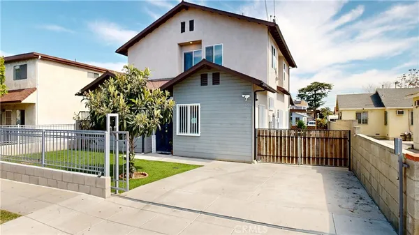 a view of a backyard with seating space