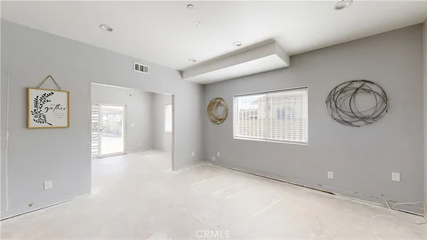 a view of a kitchen with a sink and cabinets