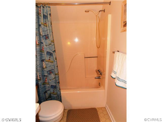4901 Rollingway Road Chesterfield, VA 23832 - Photo 11 of 14 a bathroom with a toilet and shower