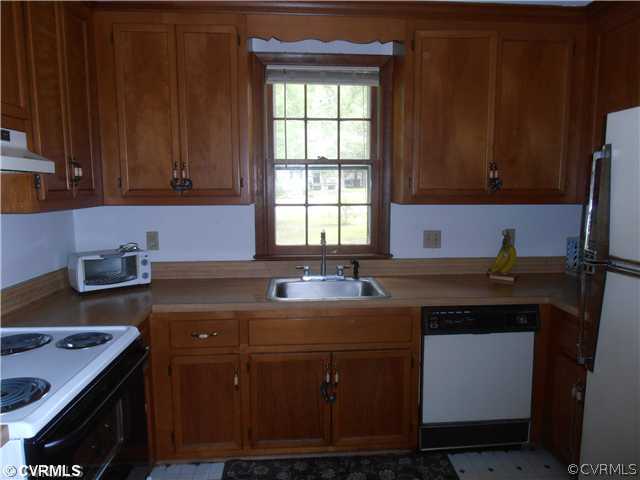 4901 Rollingway Road Chesterfield, VA 23832 - Photo 3 of 14 a kitchen with a sink cabinets and window