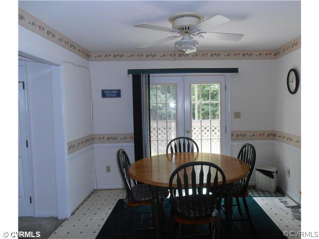4901 Rollingway Road Chesterfield, VA 23832 - Photo 5 of 14 a view of a dining room with furniture window and outside view