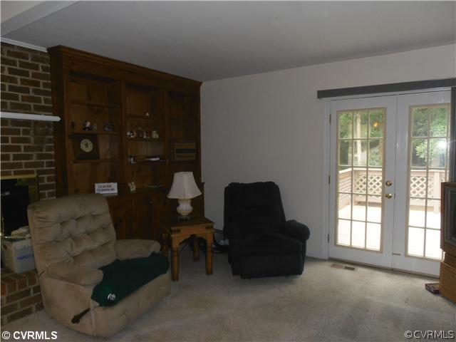 4901 Rollingway Road Chesterfield, VA 23832 - Photo 6 of 14 a living room with furniture and a window