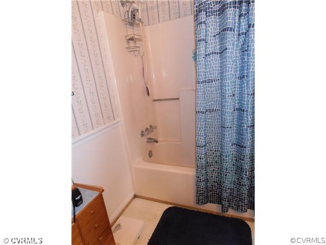 4901 Rollingway Road Chesterfield, VA 23832 - Photo 10 of 14 a bathroom with a bathtub and shower