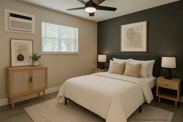 a bedroom with a bed and a window