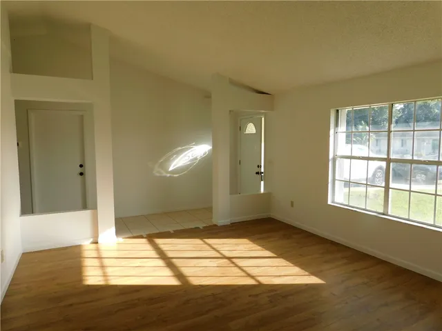 a view of an empty room and window