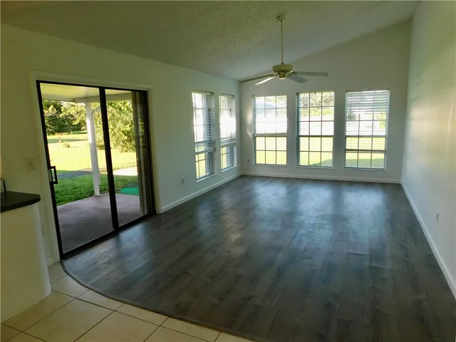 a view of an empty room with glass door
