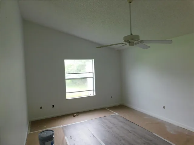 an empty room with a empty space and a window