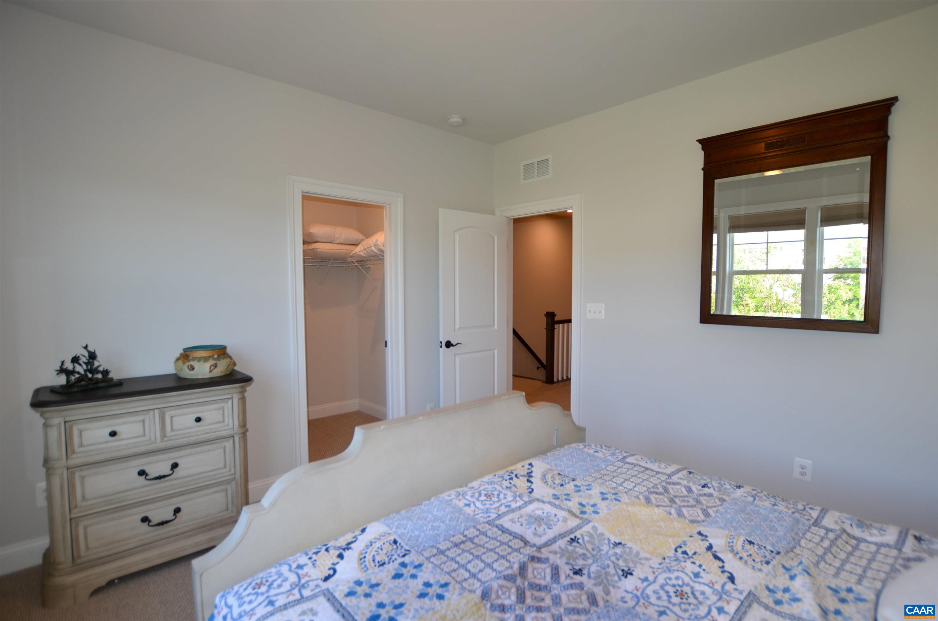 327 Claibourne Road Crozet, VA 22932 - Photo 30 of 36 a bedroom with a bed and a dresser