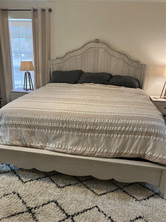 233 Church Road Stonewall, LA 71078 - Photo 13 of 32 a bedroom with a bed and wooden floor