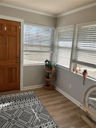 a room that has a window and a chair in it
