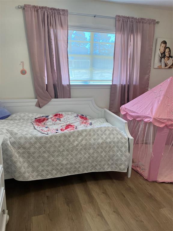 233 Church Road Stonewall, LA 71078 - Photo 10 of 32 a bedroom with a bed and a window