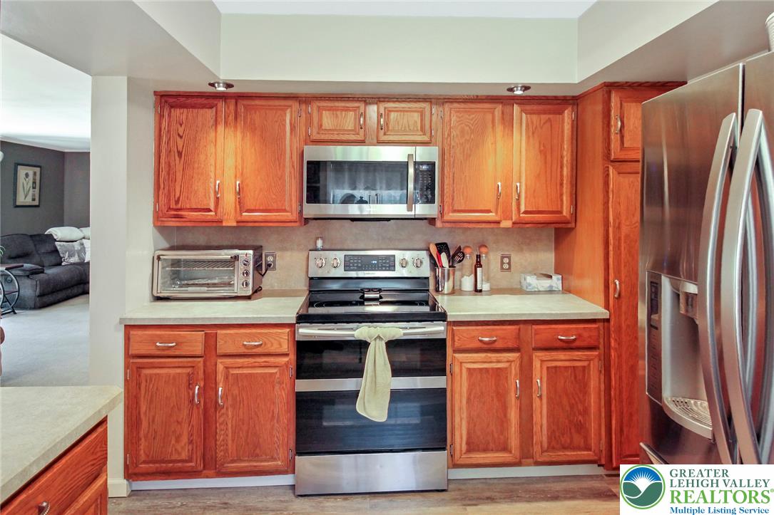 3470 Brodhead Road Bethlehem, PA 18020 - Photo 47 of 84 A well-appointed kitchen features rich wooden cabinetry complemented by stainless steel appliances.