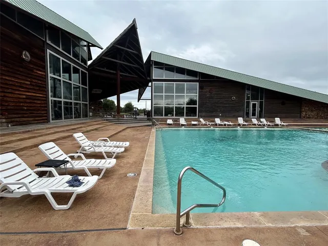 a view of a swimming pool with a lounge chairs