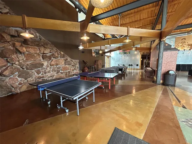 a outdoor space with lots of furniture and a table