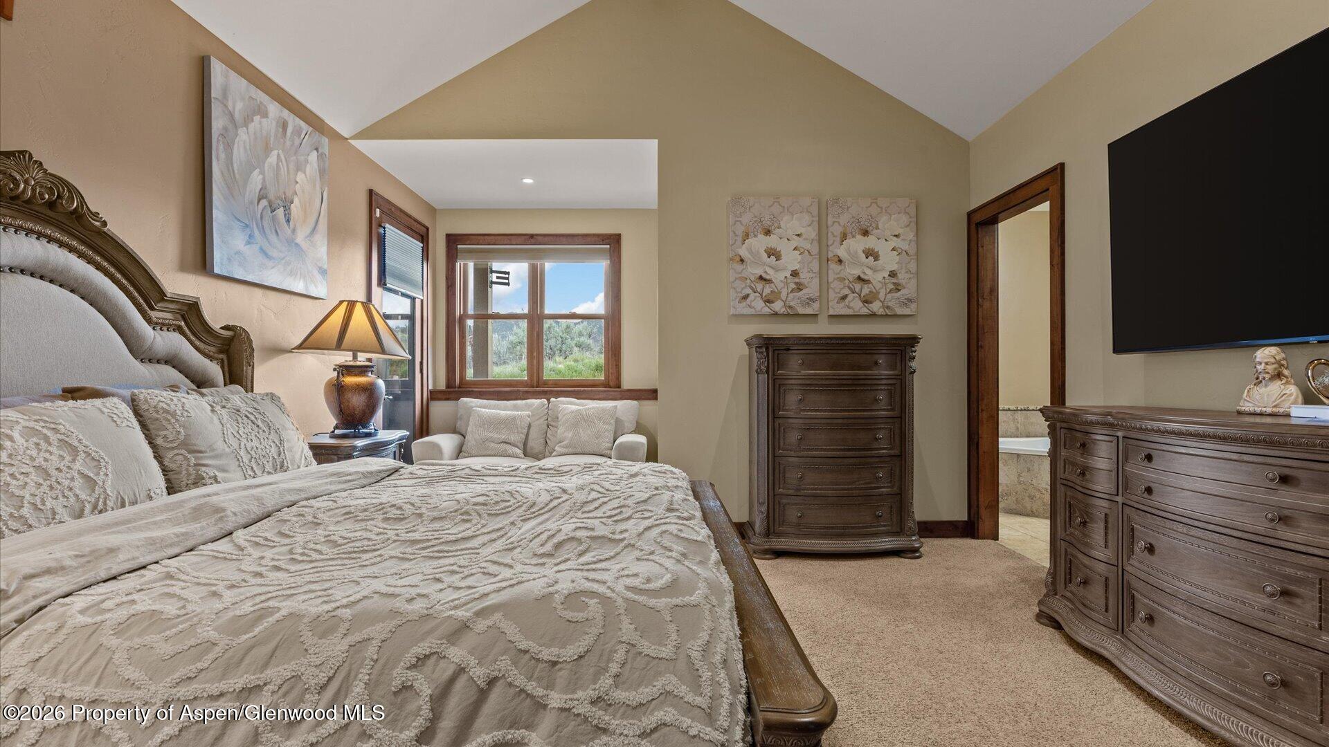829 Ute Circle New Castle, CO 81647 - Photo 14 of 37 a bedroom with a bed and a flat screen tv