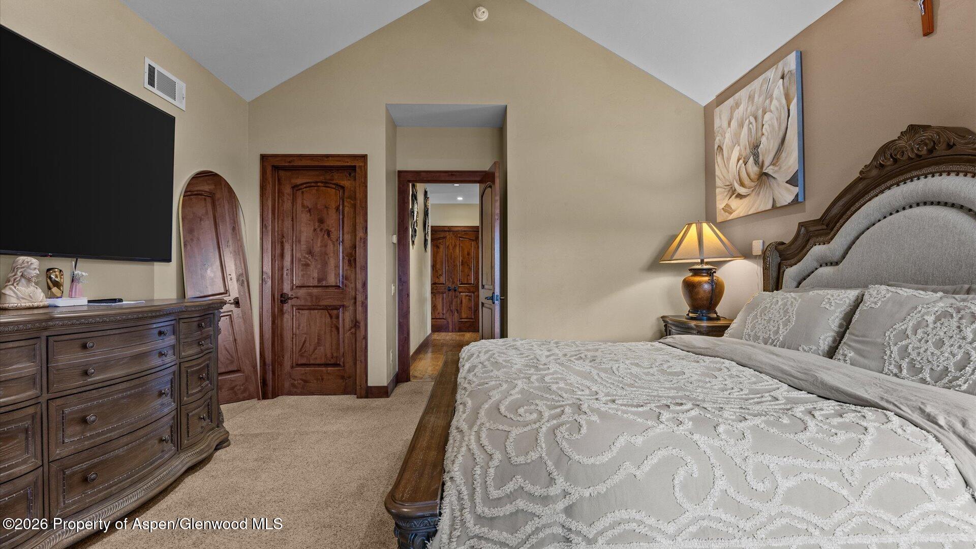 829 Ute Circle New Castle, CO 81647 - Photo 15 of 37 a bedroom with a bed and a flat screen tv