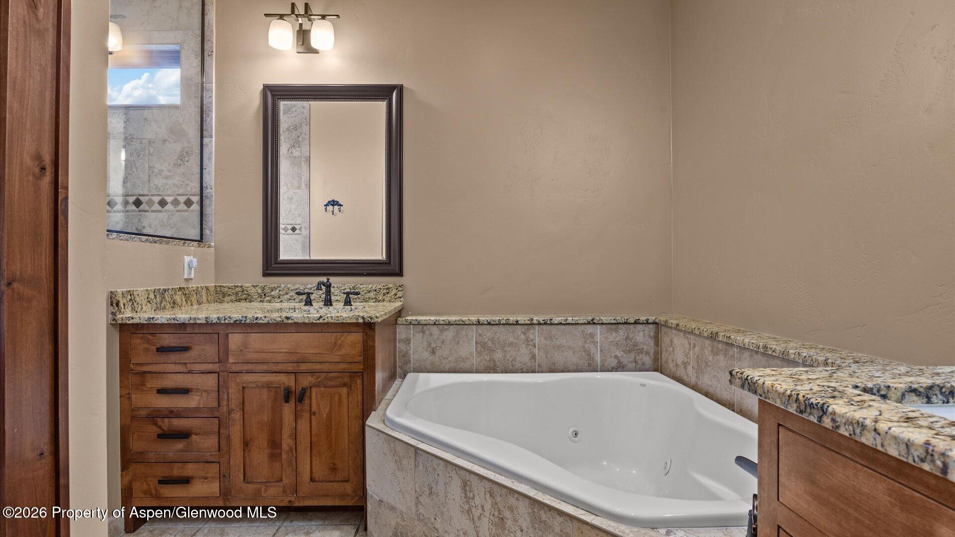 829 Ute Circle New Castle, CO 81647 - Photo 17 of 37 a bathroom with a bathtub and a sink