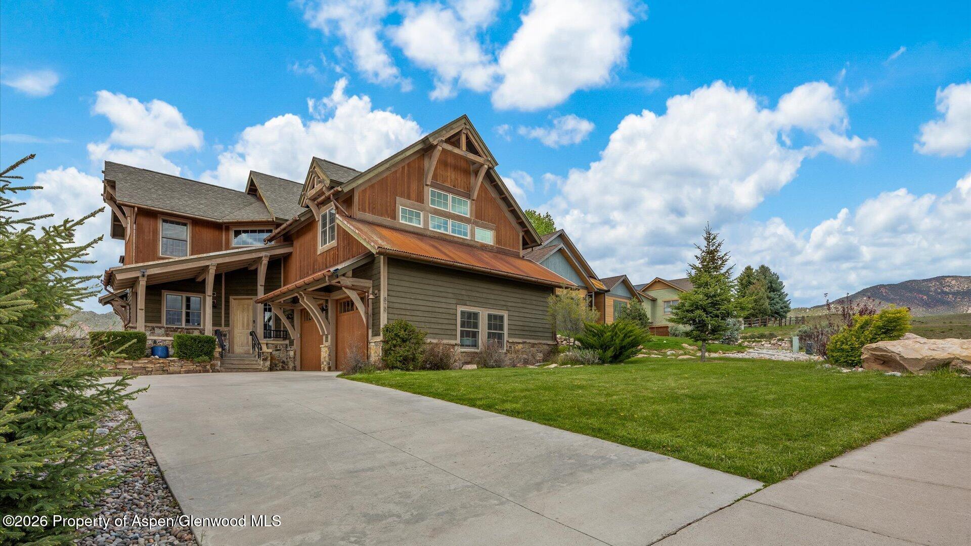829 Ute Circle New Castle, CO 81647 - Photo 2 of 37 a front view of a house with garden