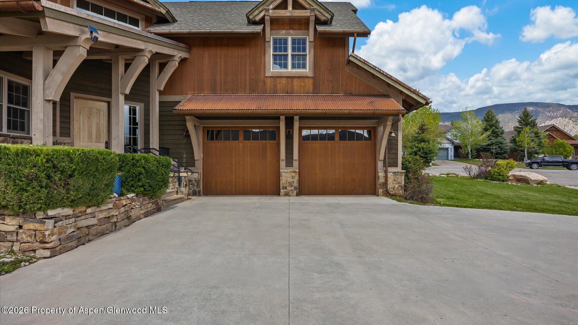 829 Ute Circle New Castle, CO 81647 - Photo 3 of 37 a front view of a house with a yard and garage