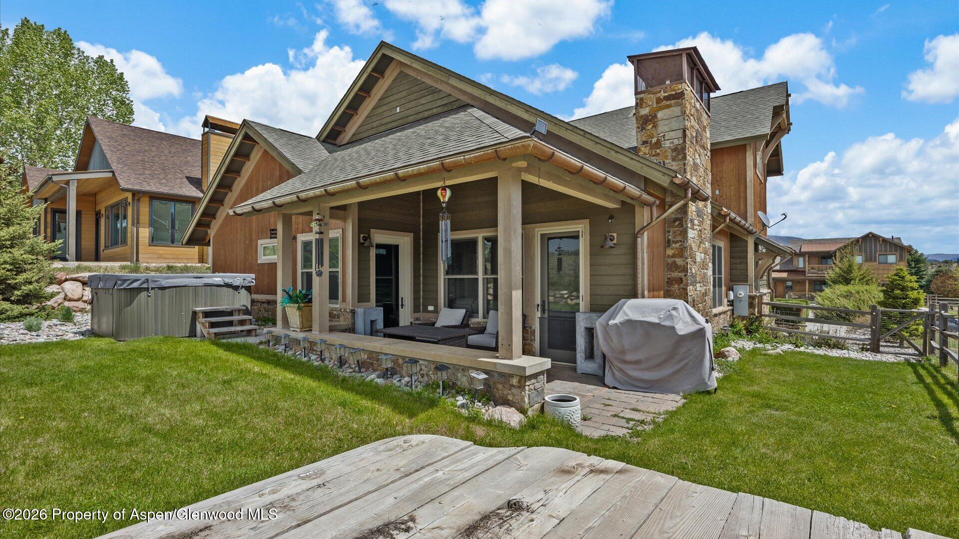 829 Ute Circle New Castle, CO 81647 - Photo 35 of 37 a view of a house with backyard sitting area and garden