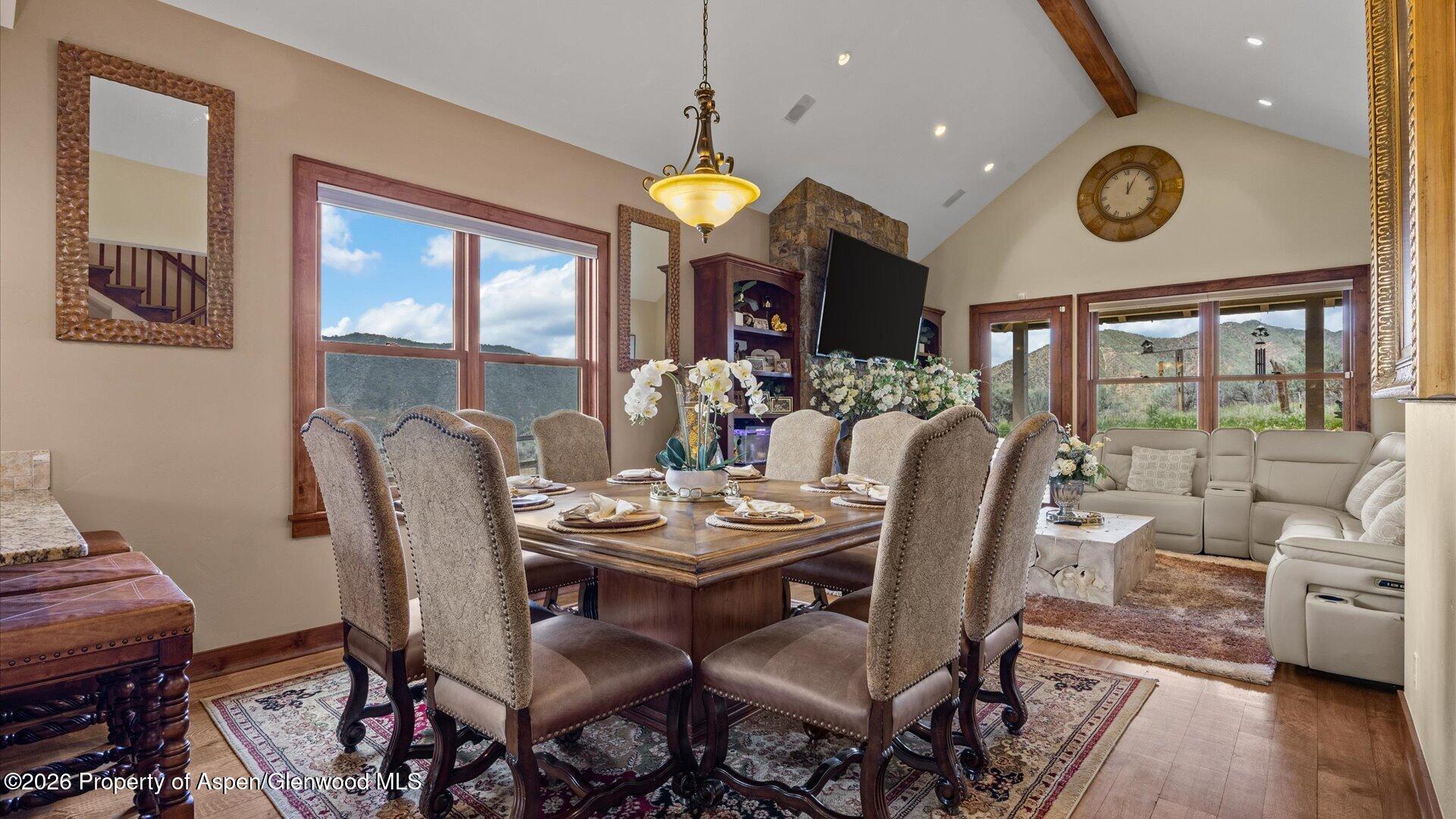 829 Ute Circle New Castle, CO 81647 - Photo 6 of 37 a view of a dining room with furniture window and wooden floor