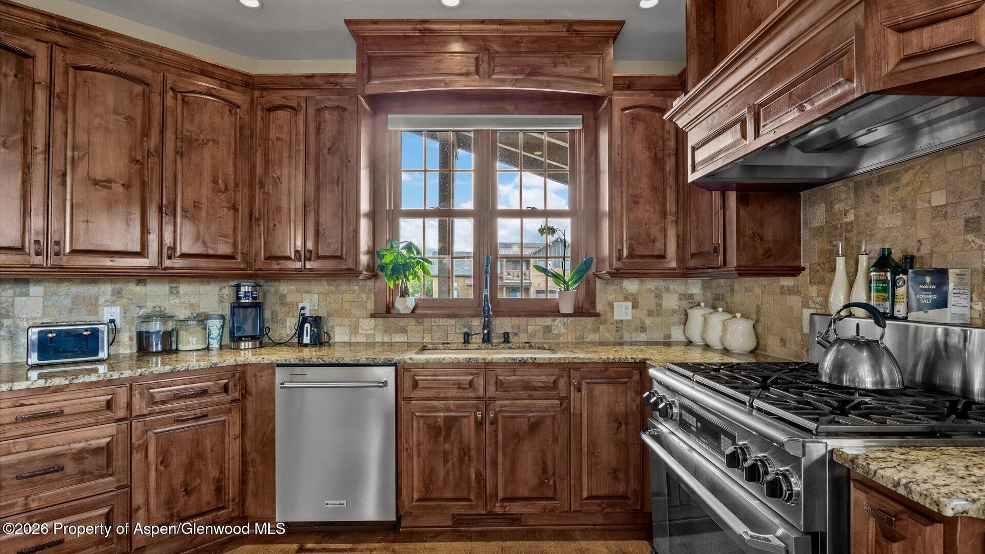 829 Ute Circle New Castle, CO 81647 - Photo 8 of 37 a kitchen with stainless steel appliances granite countertop a stove and a sink