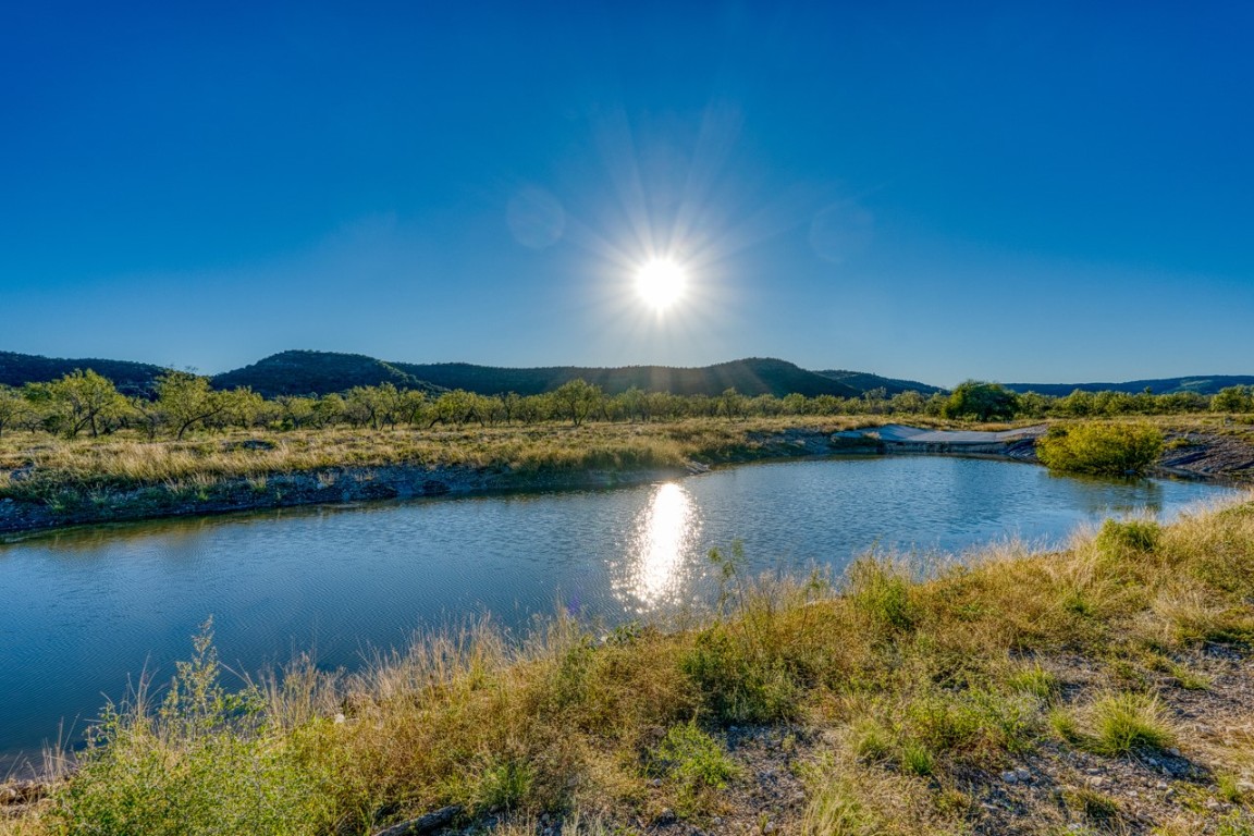 32901 Highway 55 Uvalde, TX 78801 - Photo 4 of 37 a view of a lake with a houses