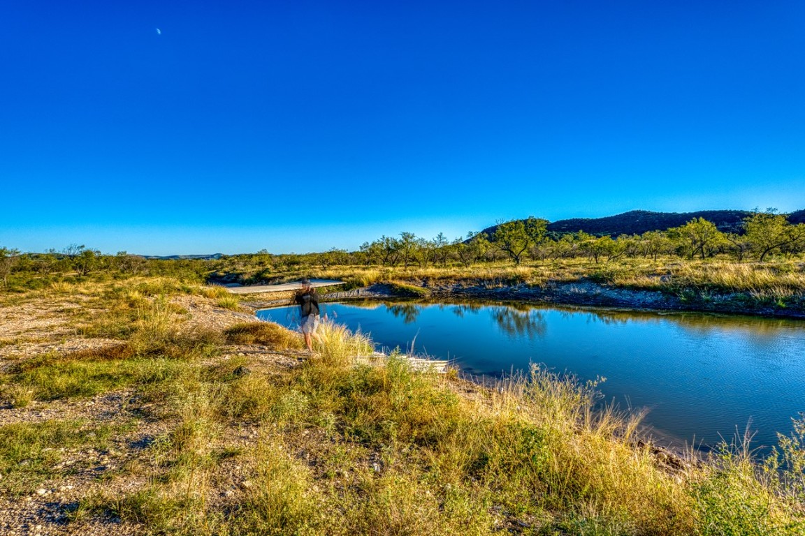 32901 Highway 55 Uvalde, TX 78801 - Photo 5 of 37 a view of a lake with houses in the back