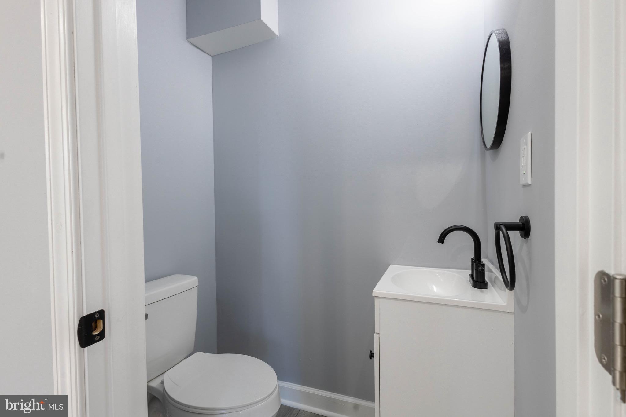 619 Aldershot Road Baltimore, MD 21229 - Photo 13 of 29 a bathroom with a toilet and sink